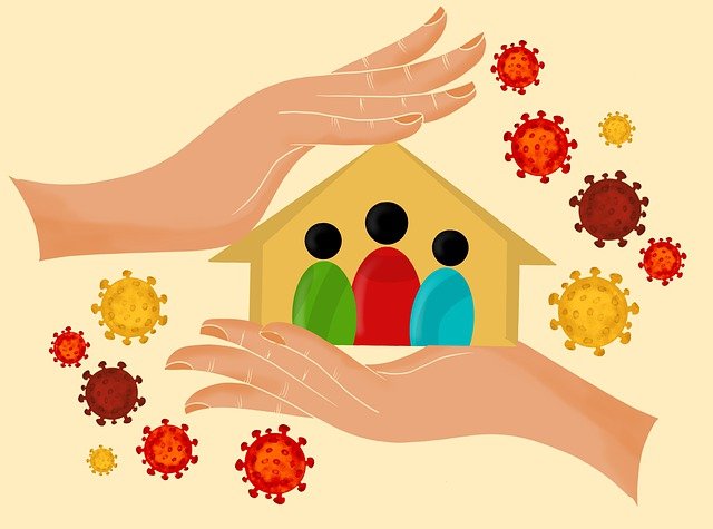 A family in a house cradled between hands, surrounded by coronavirus